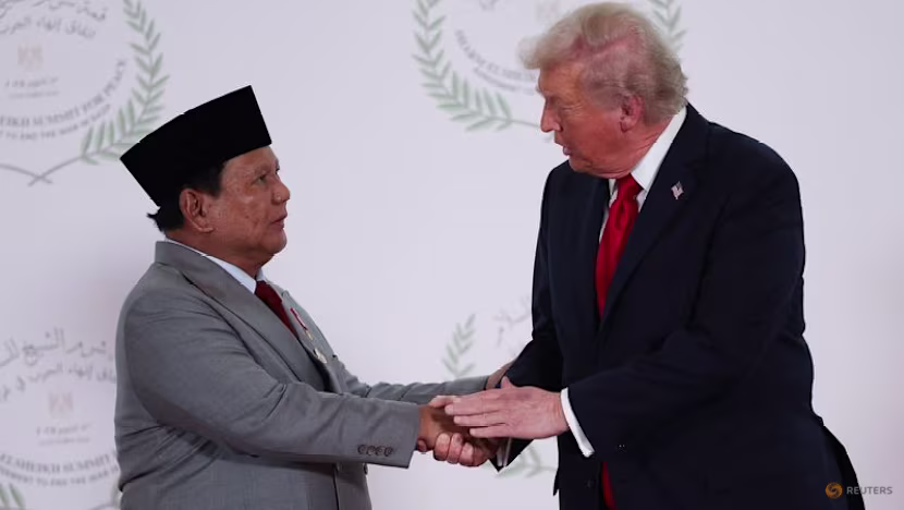 US President Donald Trump and Indonesian President Prabowo Subianto shake hands as they pose for a photo, at a world leaders' summit on ending the Gaza war, amid a US-brokered prisoner-hostage swap and ceasefire deal between Israel and Hamas, in Sharm el-Sheikh, Egypt on Oct 13, 2025. (Photo: Reuters/Suzanne Plunkett/Pool)